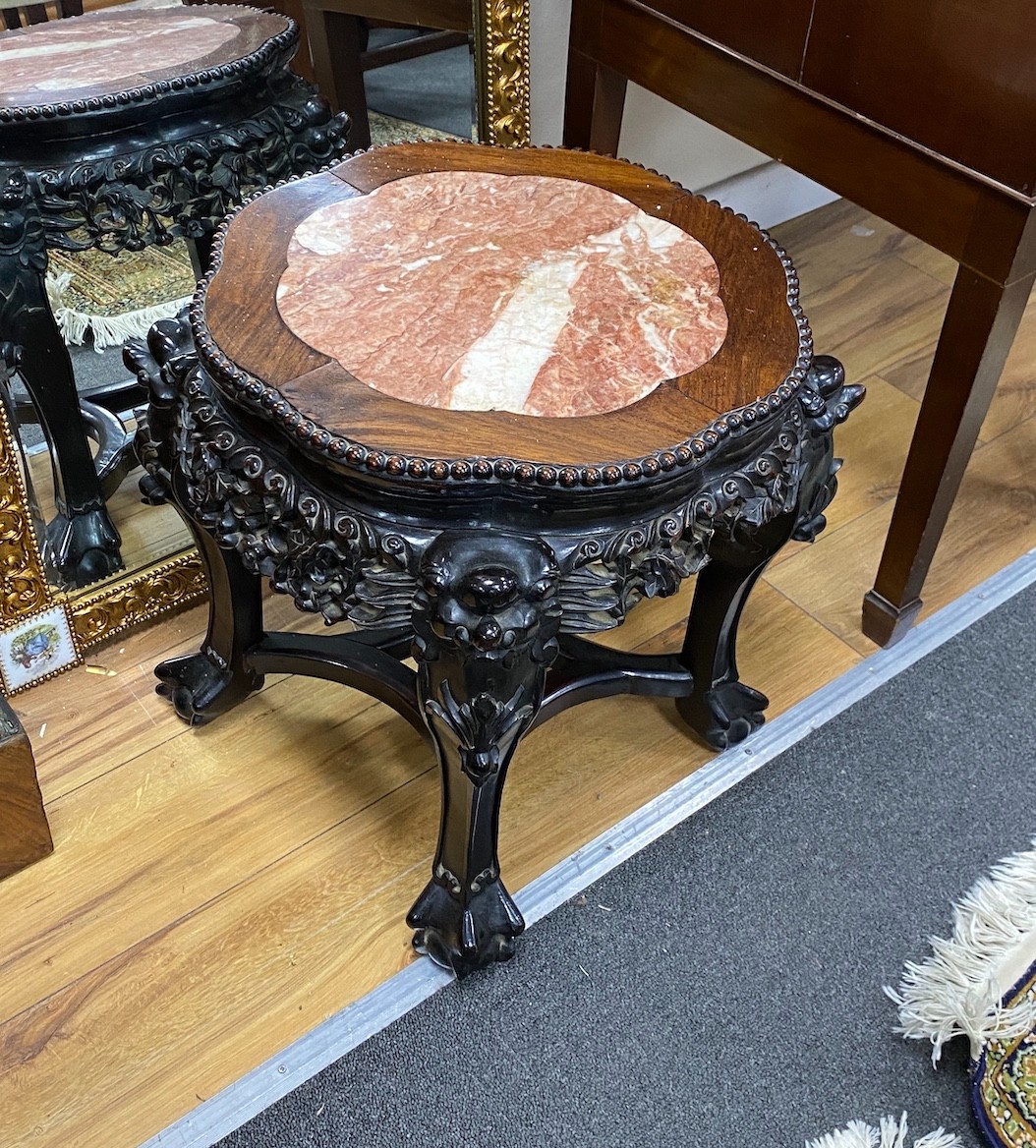A Chinese circular carved hardwood marble topped jardiniere stand, diameter 38cm, height 35cm